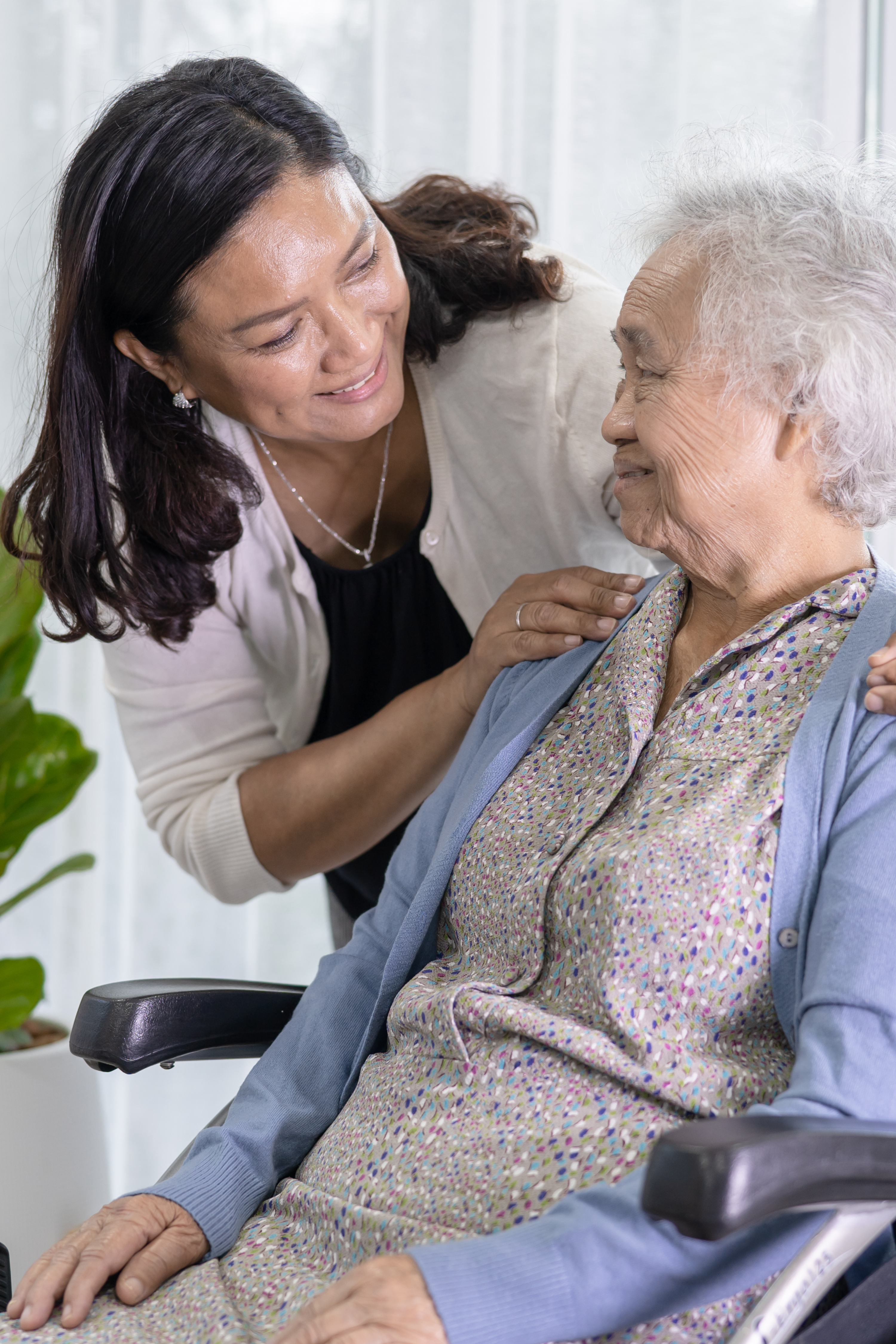 Home health nurse assisting older gentleman with medication.